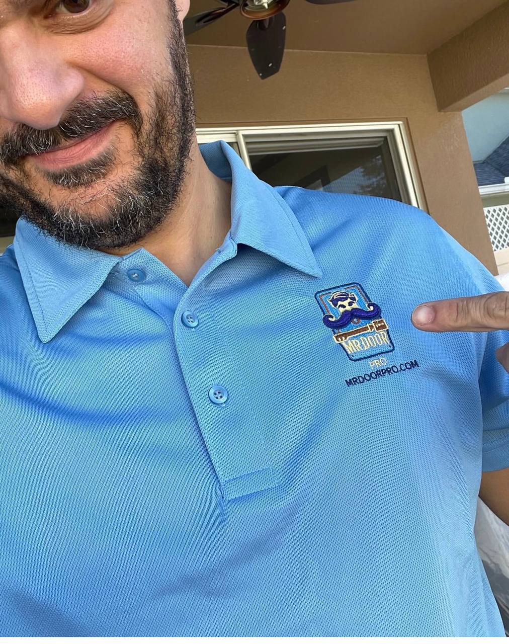 Davi from Mr Door Pro, sliding door technician inspecting worn rollers in Orlando FL